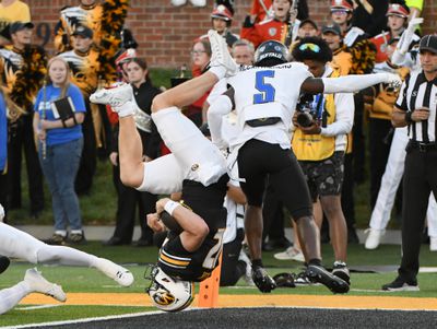 Brady Cook flips upside down into the end zone